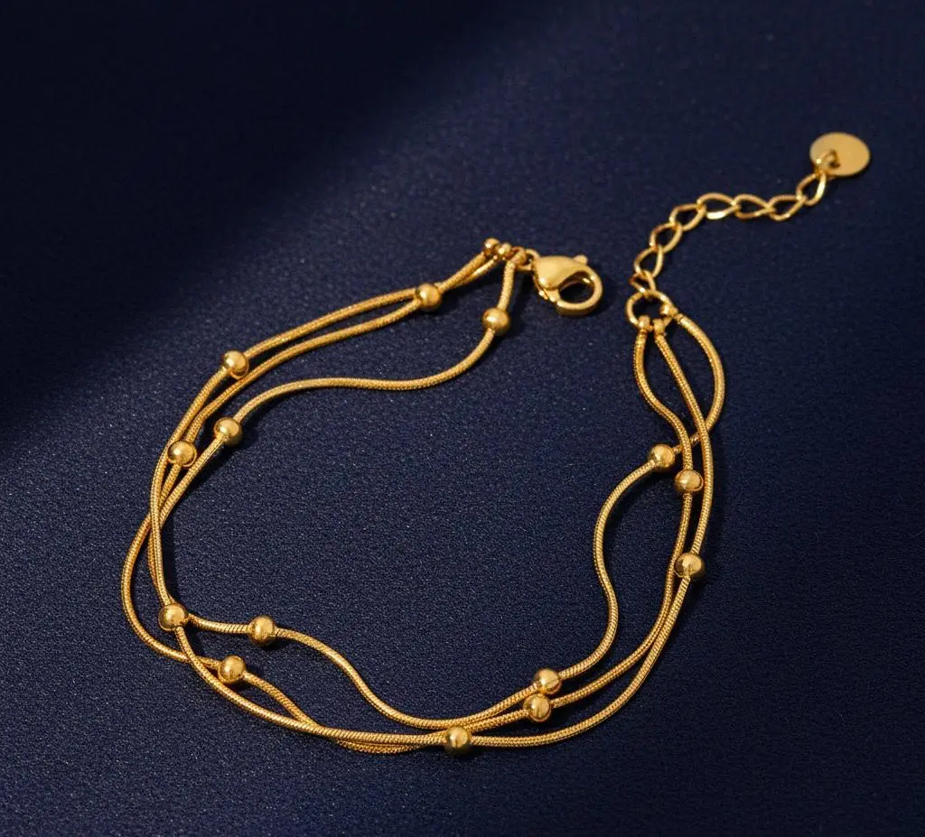 Gourmette triple billes dorées